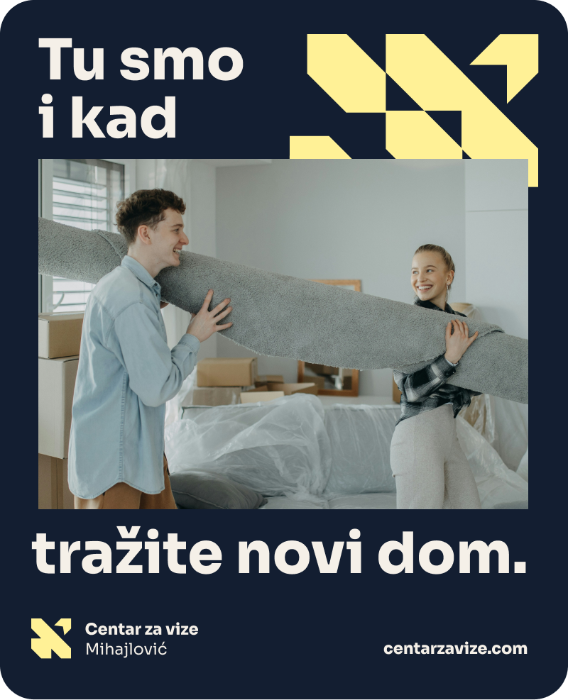 Photo of a man in a room using a tablet computer